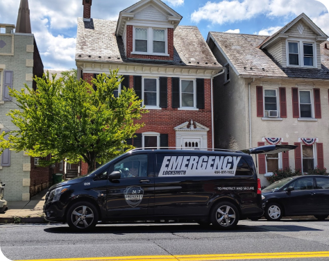 emergency locksmith van in front of brick house