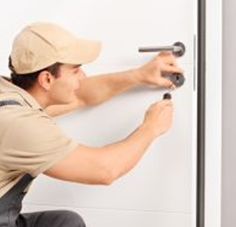 a locksmith tests a deadbolt