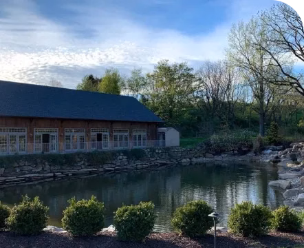 a barn over a lake