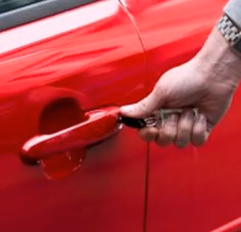 a car key in a car door lock