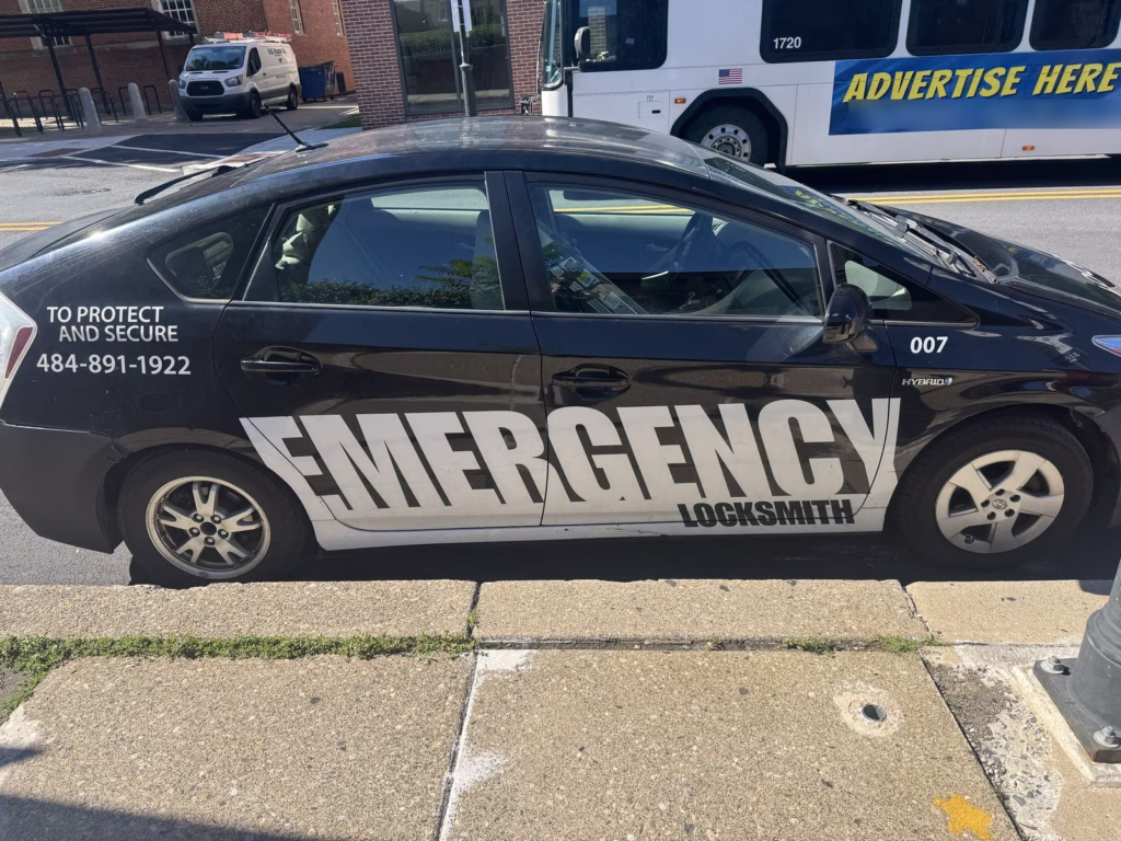 Emergency Locksmith service car parked on the street