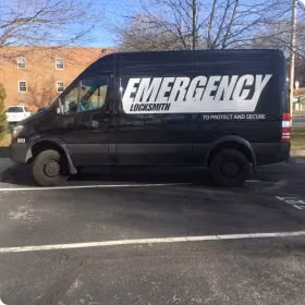 emergency locksmith van in front of brick house