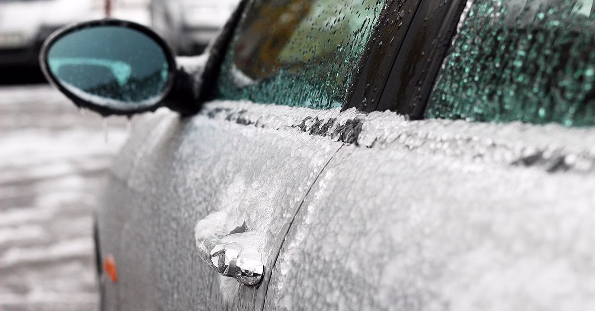 Car door and side mirror coated in ice