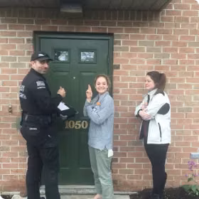 locksmith and satisfied lockout customers outside of home